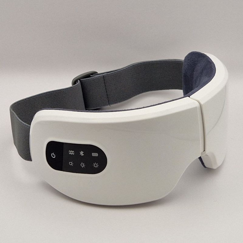 Masseur oculaire Ocucare posé sur un fond blanc, illustrant son design élégant et moderne, parfait pour les soins des yeux, réduction des cernes et de la fatigue.